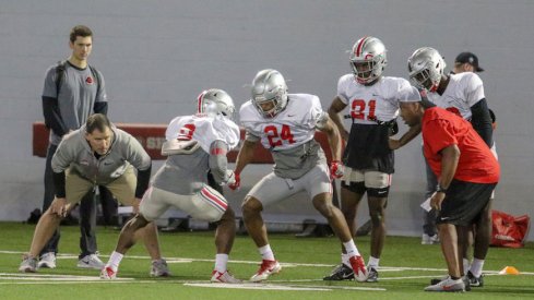 Kendall Sheffield (8) and Shaun Wade (24) compete during a drill in practice.