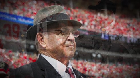 Oct 1, 2016; Columbus, OH, USA; Former Ohio State Buckeyes head coach Earle Bruce awaits on the sidelines for his chance to dot the "I" during the marching band's Script Ohio performance before the game against the Rutgers Scarlet Knights at Ohio Stadium. Ohio State won the game 58-0. Mandatory Credit: Greg Bartram-USA TODAY Sports