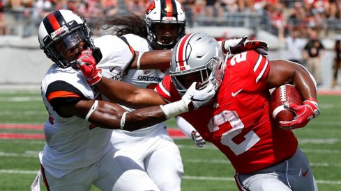 Ohio State's J.K. Dobbins breaks a tackle during Saturday's 77-31 win over Oregon State.