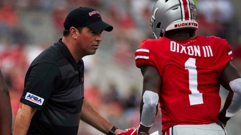 Ohio State acting head coach Ryan Day talks to Ohio State wide receiver Johnnie Dixon (1) during the second half against the Oregon State Beavers at Ohio Stadium.