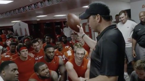 Ohio State coach Ryan Day receives the game ball following his team's 77-31 win over Oregon State