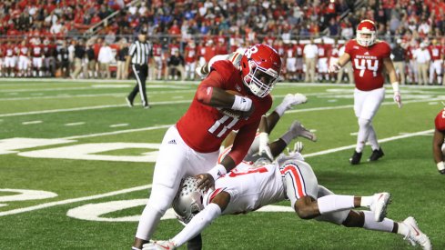 Ohio State's Denzel Ward tackles a Rutgers ball-carrier.