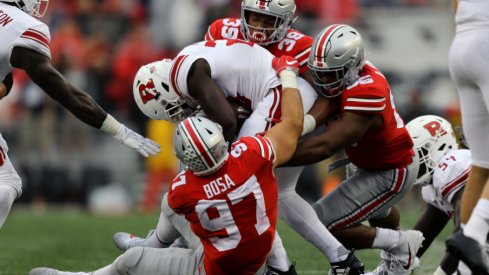 Rutgers running back Jonathan Hilliman (23) is tackled by Ohio State's Nick Bosa (97), Javontae Jean-Baptiste (38), and Dre'Mont Jones (86) in the first half at Ohio Stadium.