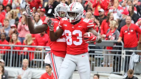 Parris Campbell and Terry McLaurin celebrate in the end zone.