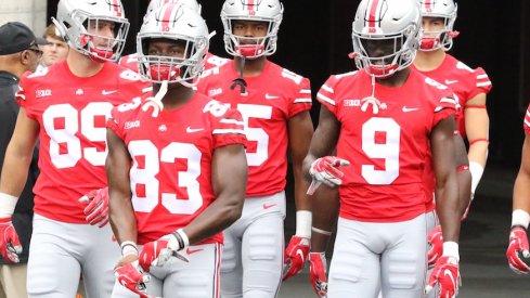 Terry McLaurin leads several of his teammates onto the field before Ohio State's game against Tulane.