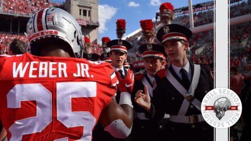 Mike Weber high fives the band.