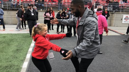 Ryan Day's daughter Grace hugs J.T. Barrett