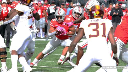 J.K. Dobbins tries to find a hole against Minnesota