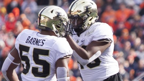 Oct 13, 2018; Champaign, IL, USA; Purdue Boilermakers linebackers Derrick Barnes (55) and Cornel Jones (46) celebrate after sacking Illinois Fighting Illini quarterback AJ Bush Jr. (1) during the second quarter at Memorial Stadium. Mandatory Credit: Mike Granse-USA TODAY Sports