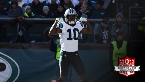 Curtis Samuel flexes after scoring a touchdown.