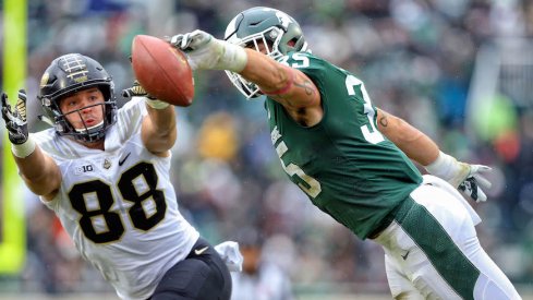 Michigan State's Joe Bachie breaks up a pass intended for Purdue's Cole Herdman.