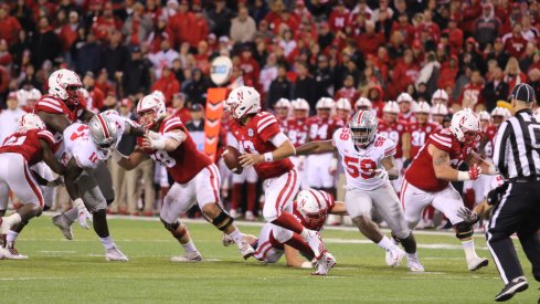 The Rushmen collapse on Nebraska's quarterback. 