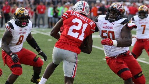 Parris Campbell attempts to break free of some nasty Terrapins. 