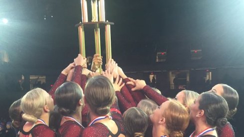 The Ohio State Dance Team raises their hardware. 