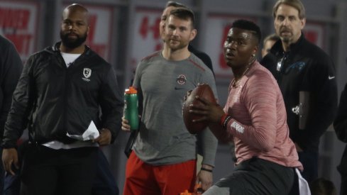 Quincy Avery (left) watches Dwayne Haskins throw at Ohio State's pro day.