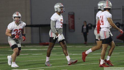 Ohio State defensive players, including Tuf Borland (32), Baron Browning (5) and Isaiah Pryor (14).