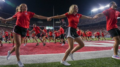 Sep 17, 2022; Columbus, Ohio, USA; Ohio State Buckeyes alumni cheerleaders circle the endzone following a touchdown during the second half of the NCAA Division I football game against the Toledo Rockets at Ohio Stadium. Ohio State won 77-21. Mandatory Credit: Adam Cairns-The Columbus Dispatch Ncaa Football Toledo Rockets At Ohio State Buckeyes