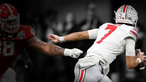 Ohio State quarterback C.J. Stroud (7) escapes a tackle from Georgia defensive lineman Jalen Carter (88) during the first half of the Chick-fil-A Peach Bowl NCAA College Football Playoff semifinal game on Saturday, Dec 31, 2022, in Atlanta. News Joshua L Jones Syndication Online Athens