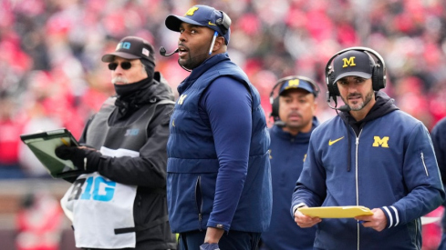 Michigan interim head coach Sherrone Moore (left) and defensive coordinator Jesse Minter