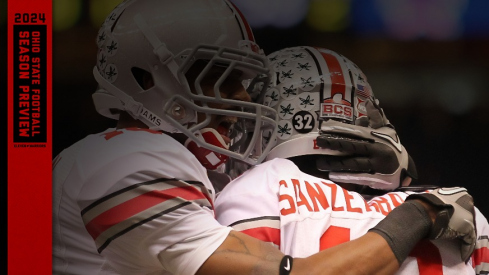 Jan 4, 2011; New Orleans, LA, USA; Ohio State Buckeye receiver Dane Sanzenbacher (12) celebrates his second quarter touchdown with receiver Corey Brown (10) against the Arkansas Razorbacks during the 2011 Sugar Bowl at the Louisiana Superdome . Mandatory Credit: Matthew Emmons-USA TODAY Sports