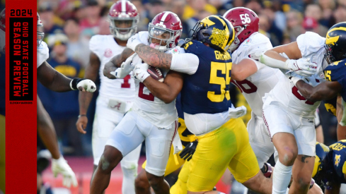 Michigan's Mason Graham makes a tackle