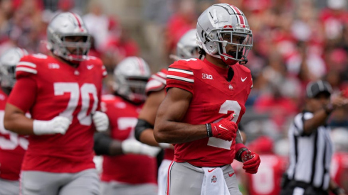 Emeka Egbuka leading Ohio State players out of the tunnel in 2023