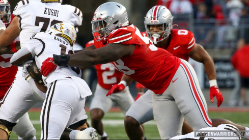 Ty Hamilton tackling Western Michigan’s Zahir Abdus-Salaam for no gain on the second play of Ohio State’s 56-0 win over the Broncos.