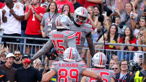 Ohio State players celebrate a touchdown against Iowa