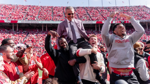 2014 National Championship team lifts Urban Meyer into the air