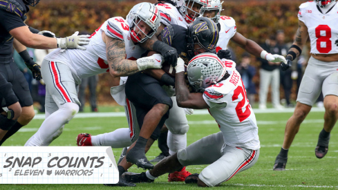 Jack Sawyer and Arvell Reese combining for a tackle