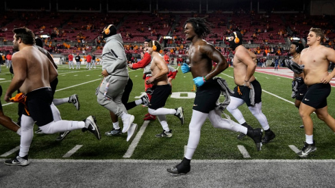 The Tennessee Volunteers take the field for warm ups without shirts in sub-freezing temperatures prior to the College Football Playoff first round game against the Ohio State Buckeyes at Ohio Stadium in Columbus on Dec. 21, 2024.