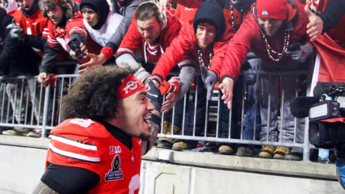 Ohio State player Lathan Ransom celebrates with fans