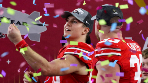 Ohio State players Will Howard and Jack Sawyer celebrate their win over Texas