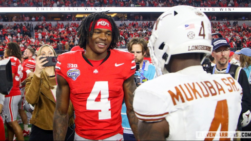 Jeremiah Smith speaks with Texas DB Andrew Mukuba after the Cotton Bowl