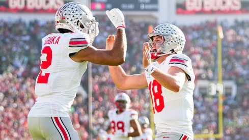 Emeka Egbuka celebrating with Will Howard