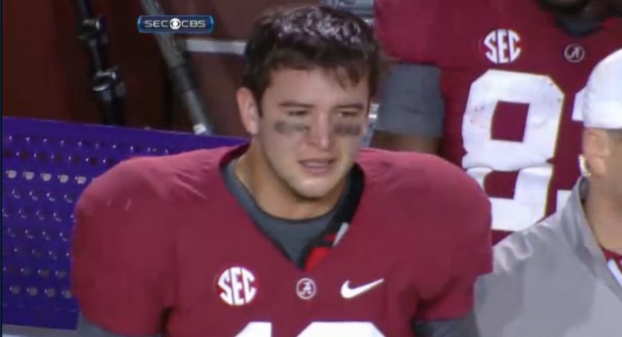 Katherine in an Alabama jersey. A.J. was a quarter back for Alabama for two  years.