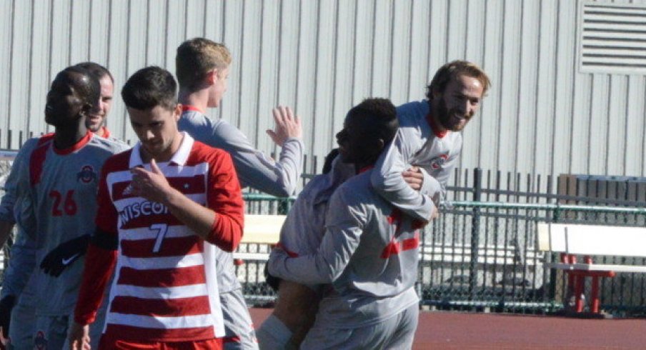 Senior Zach Mason celebrates with freshman Abdi Mohamed.