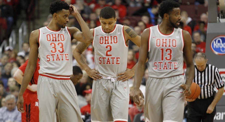 Keita Bates-Diop, Marc Loving and JaQuan Lyle walk off the floor.