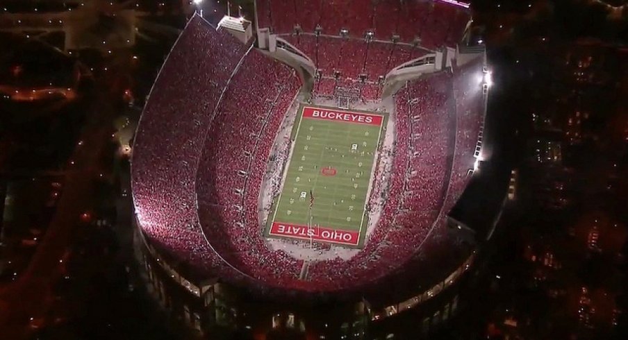 Ohio Stadium under the lights look back.