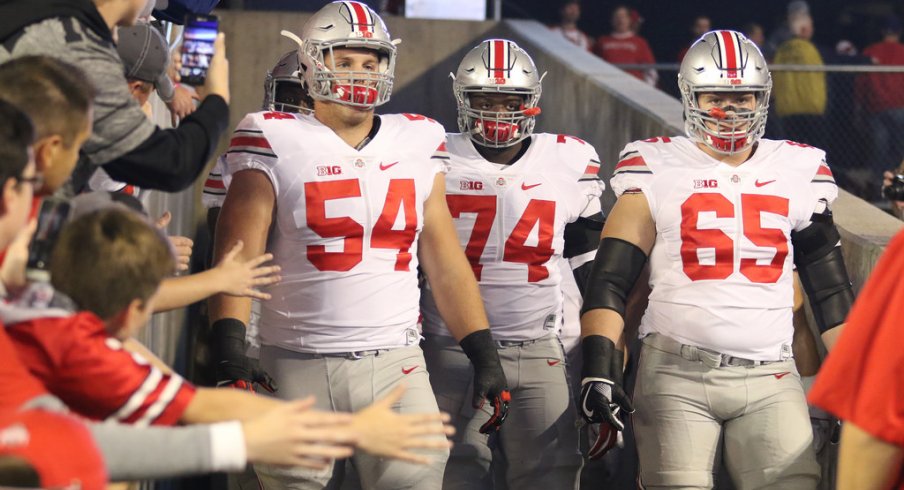 Billy Price, Jamarco Jones and Pat Elflein take the field at Wisconsin. 