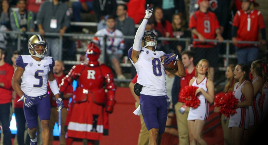 Sep 1, 2017; Piscataway, NJ, USA; Washington Huskies wide receiver Dante Pettis (8) celebrates his punt return touchdown during the first half of their game against the Rutgers Scarlet Knights at High Point Solutions Stadium. Mandatory Credit: Ed Mulholland-USA TODAY Sports