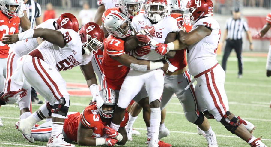 Jerome Baker tackles an Oklahoma ball carrier