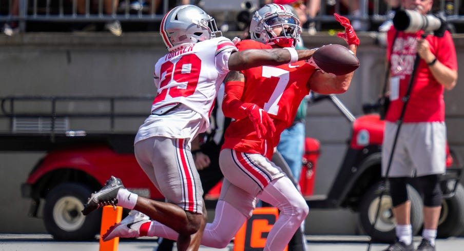 Ohio State football great Archie Griffin runs for a touchdown in the  Buckeyes' spring game 