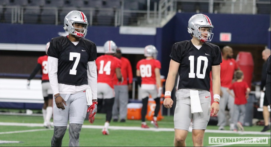 Justin Fields of the Ohio State Buckeyes looks on in the first