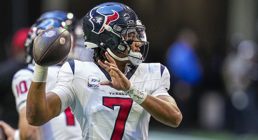 New Orleans, USA. 27th Aug, 2023. Houston Texans quarterback C.J. Stroud  (7) attempts a pass while facing a heavy pass rush from New Orleans Saints  defensive ends Tanoh Kpassagnon (92) and Carl