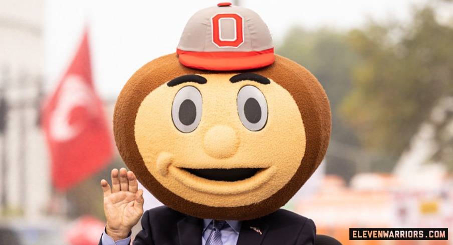 Lee Corso of ESPN's College GameDay wearing a Brutus Buckeye helmet.