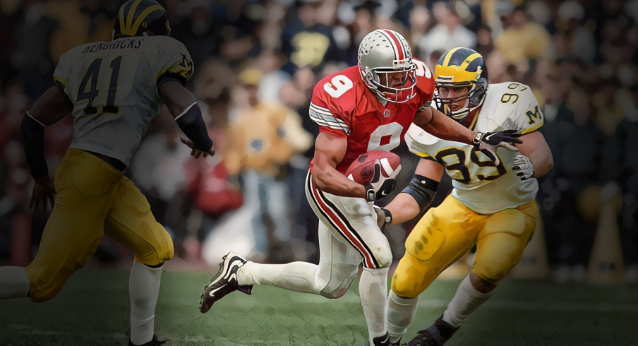 Nov 21, 1998; Columbus, OH, USA; Ohio State Buckeyes receiver David Boston (9) runs after a catch against the Michigan Wolverines at Ohio Stadium. Mandatory Credit: Matthew Emmons-USA TODAY Sports