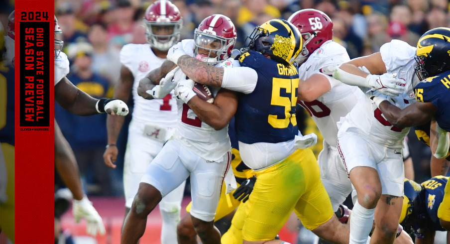 Michigan's Mason Graham makes a tackle