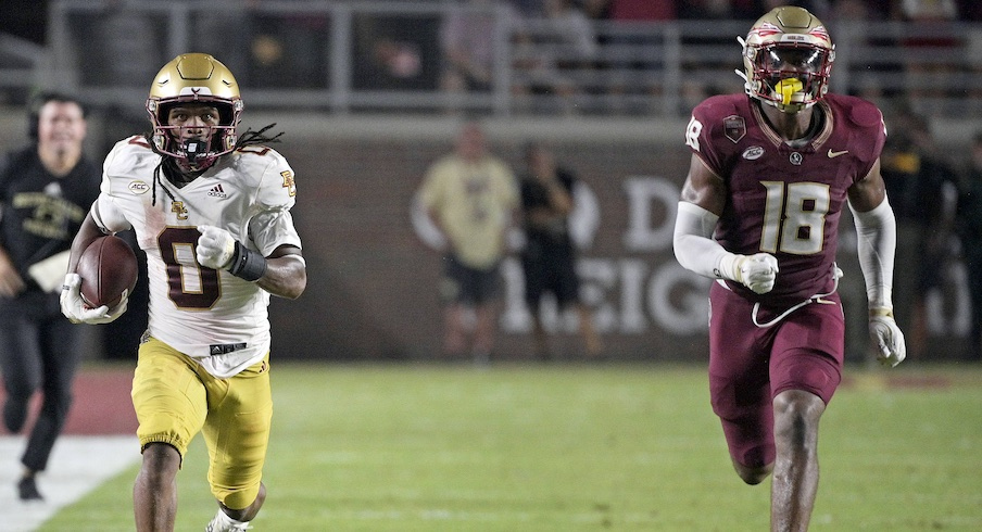 BC’s Treshaun Ward runs away from Florida State’s Cam Riley