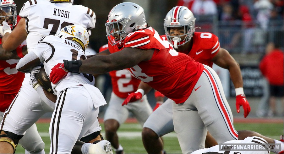 Ty Hamilton tackling Western Michigan’s Zahir Abdus-Salaam for no gain on the second play of Ohio State’s 56-0 win over the Broncos.